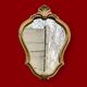 Petit miroir mural rocaille vintage en résine dorée