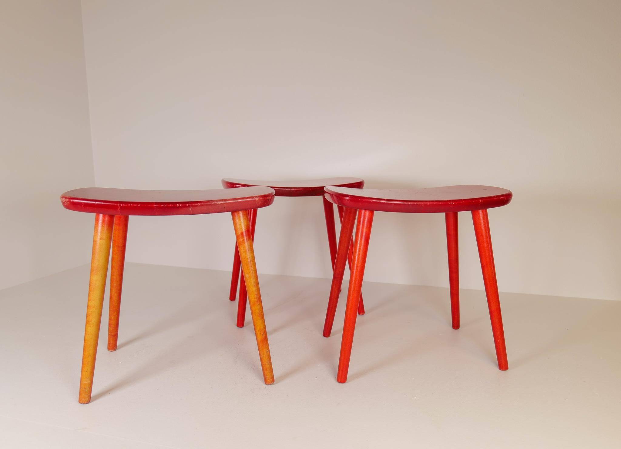 Swedish stools in red lacquered birch, Yngve Ekström "Palle", 1970s