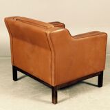 Armchair design Scandinavian brown leather.