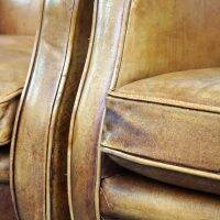 Set of English style light cognac colored leather armchairs.