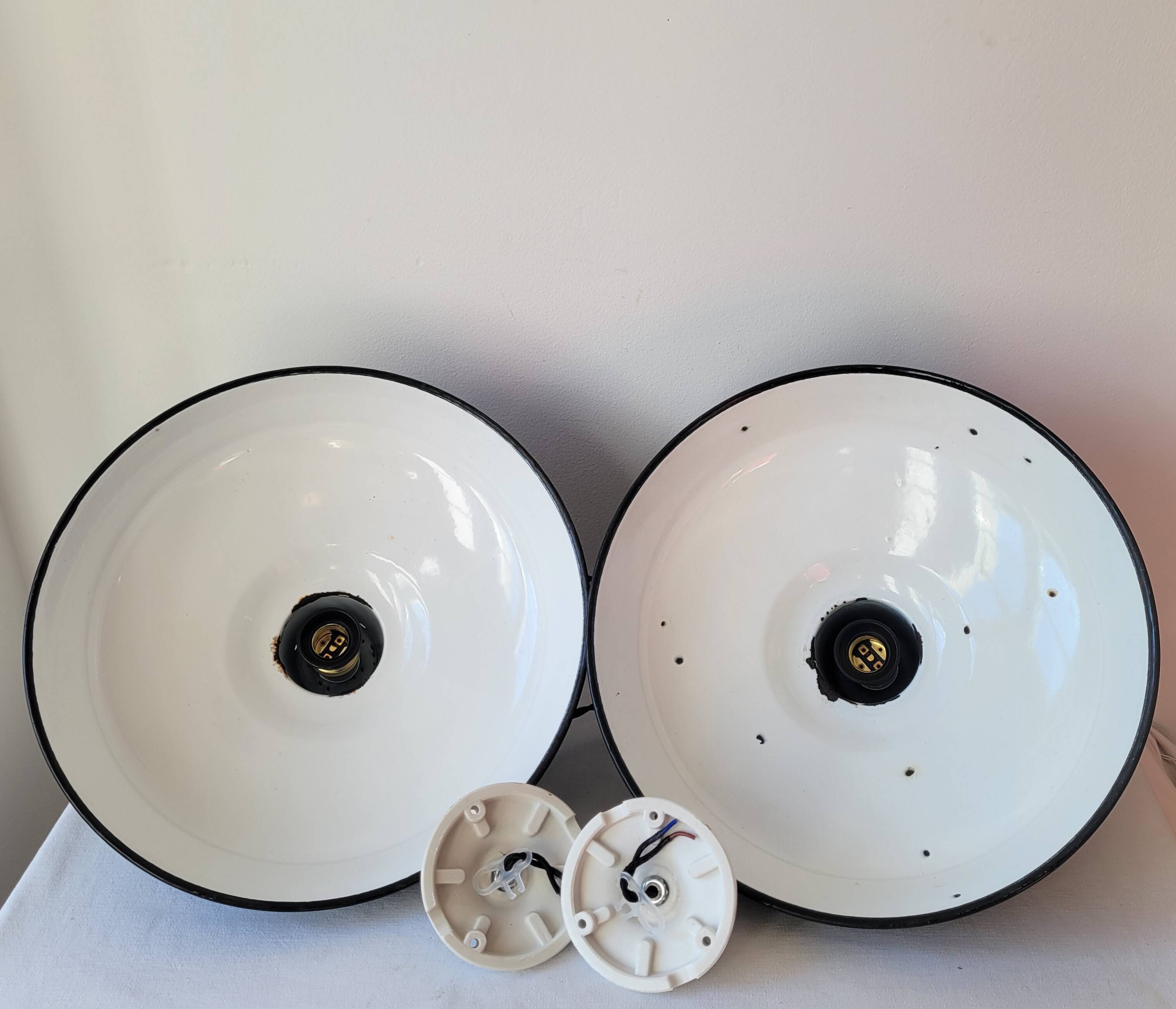 Duo of white and black enameled sheet metal pendants