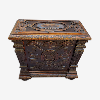 Carved wooden chest with coat of arms