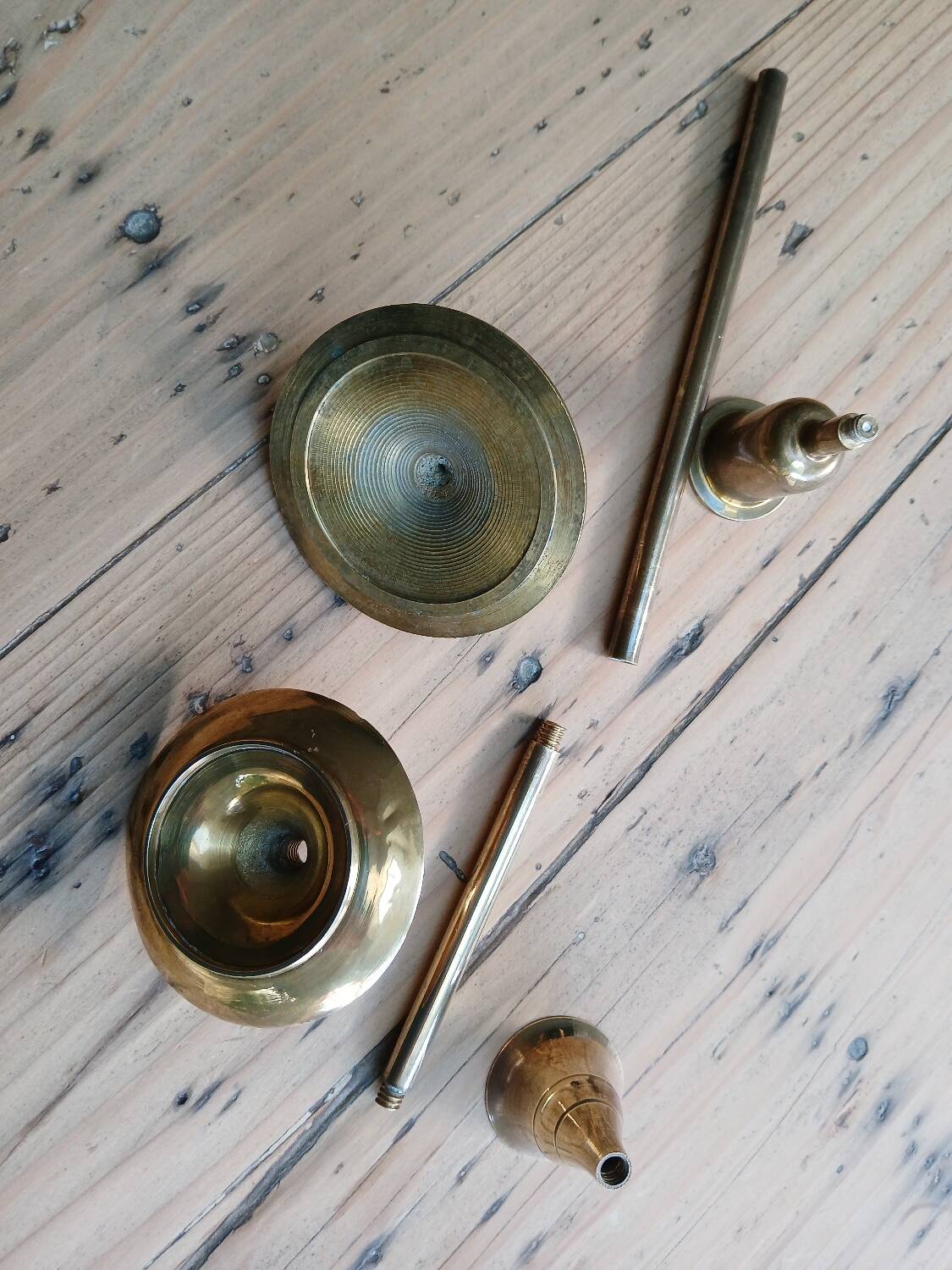 Set of two straight brass candlesticks.