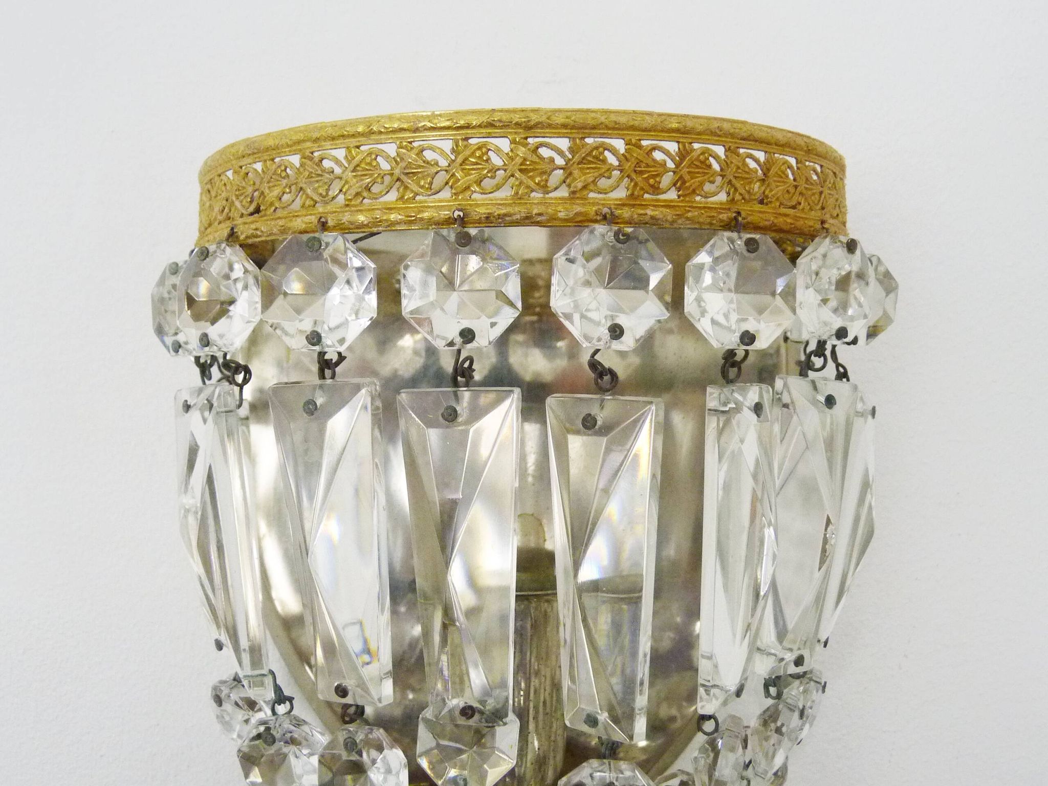 Pair of vintage bronze basket wall lights with glass pendants. The 50's