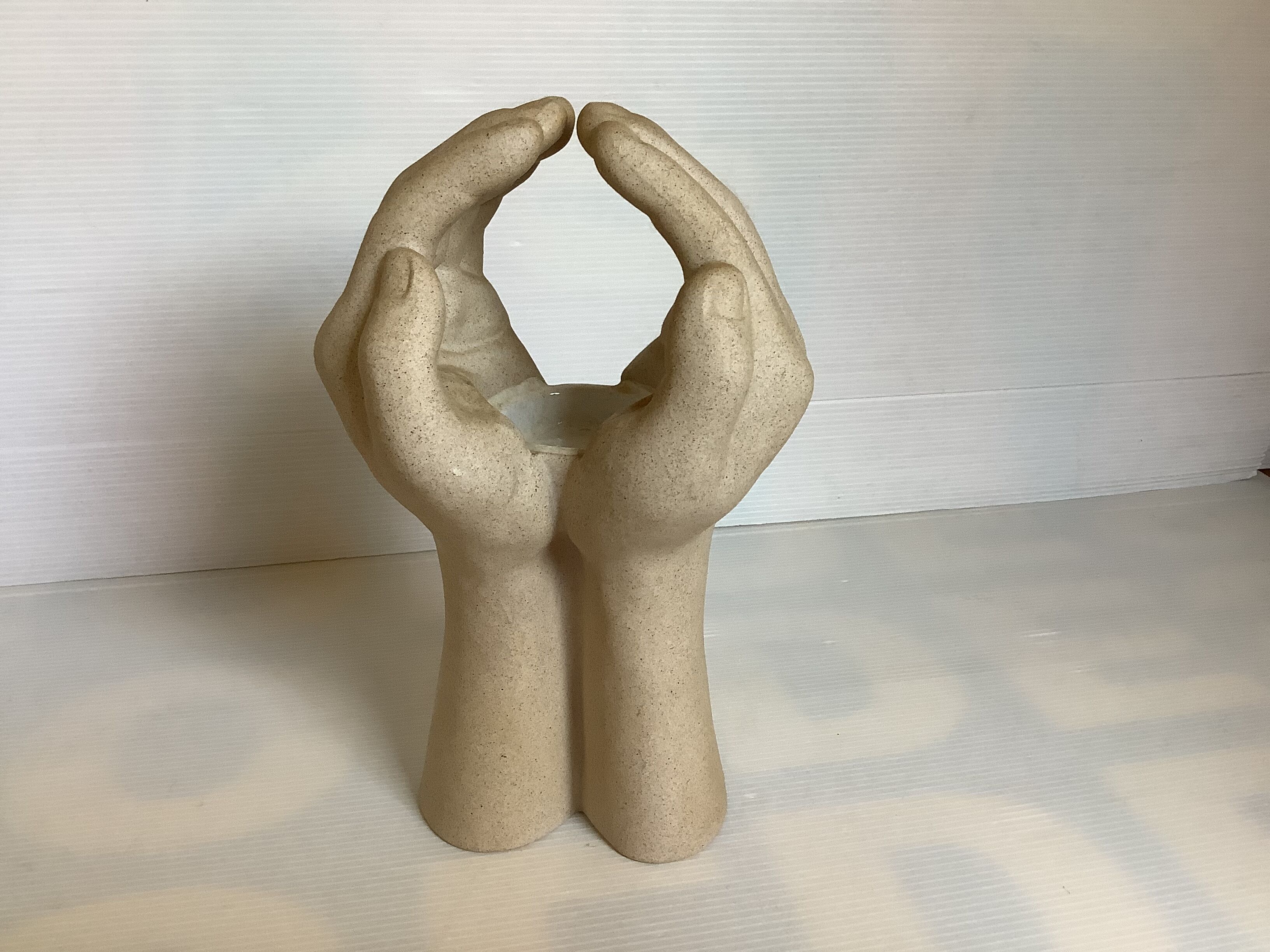 Hand-shaped candle holder