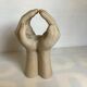 Hand-shaped candle holder