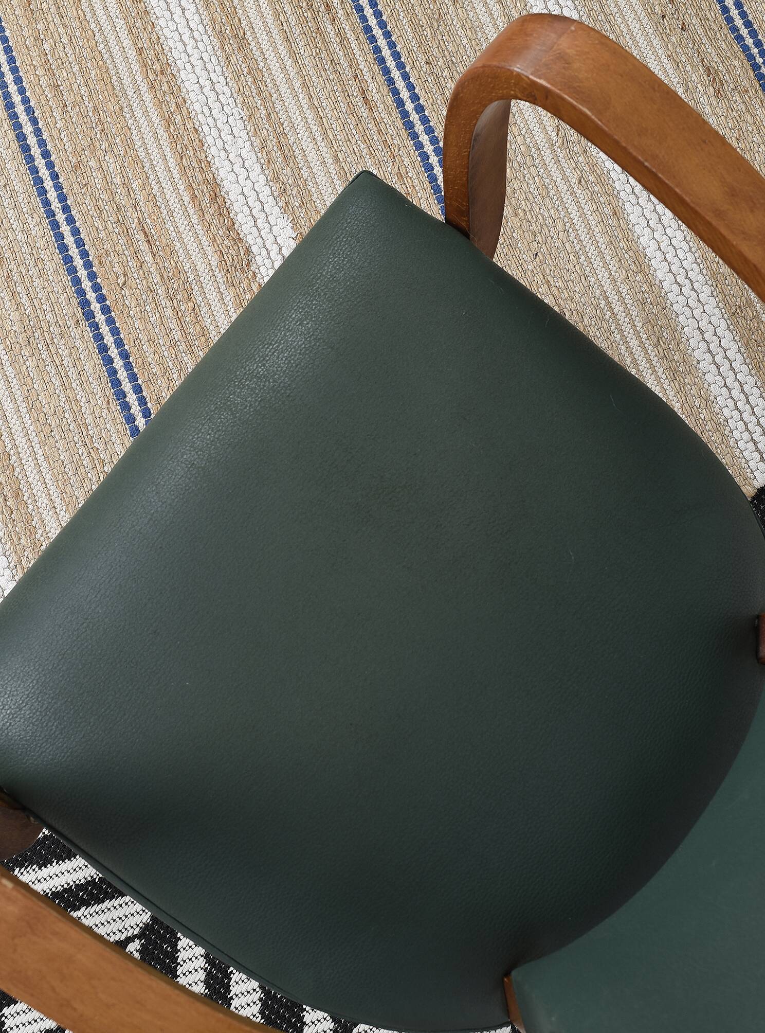 Bridge armchair in green moleskin