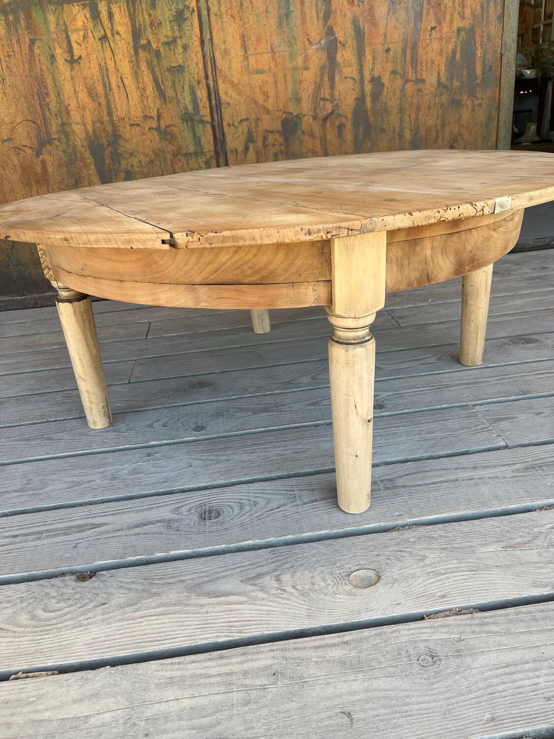 Round coffee table in raw wood
