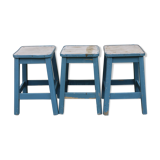 Three blue wooden stools