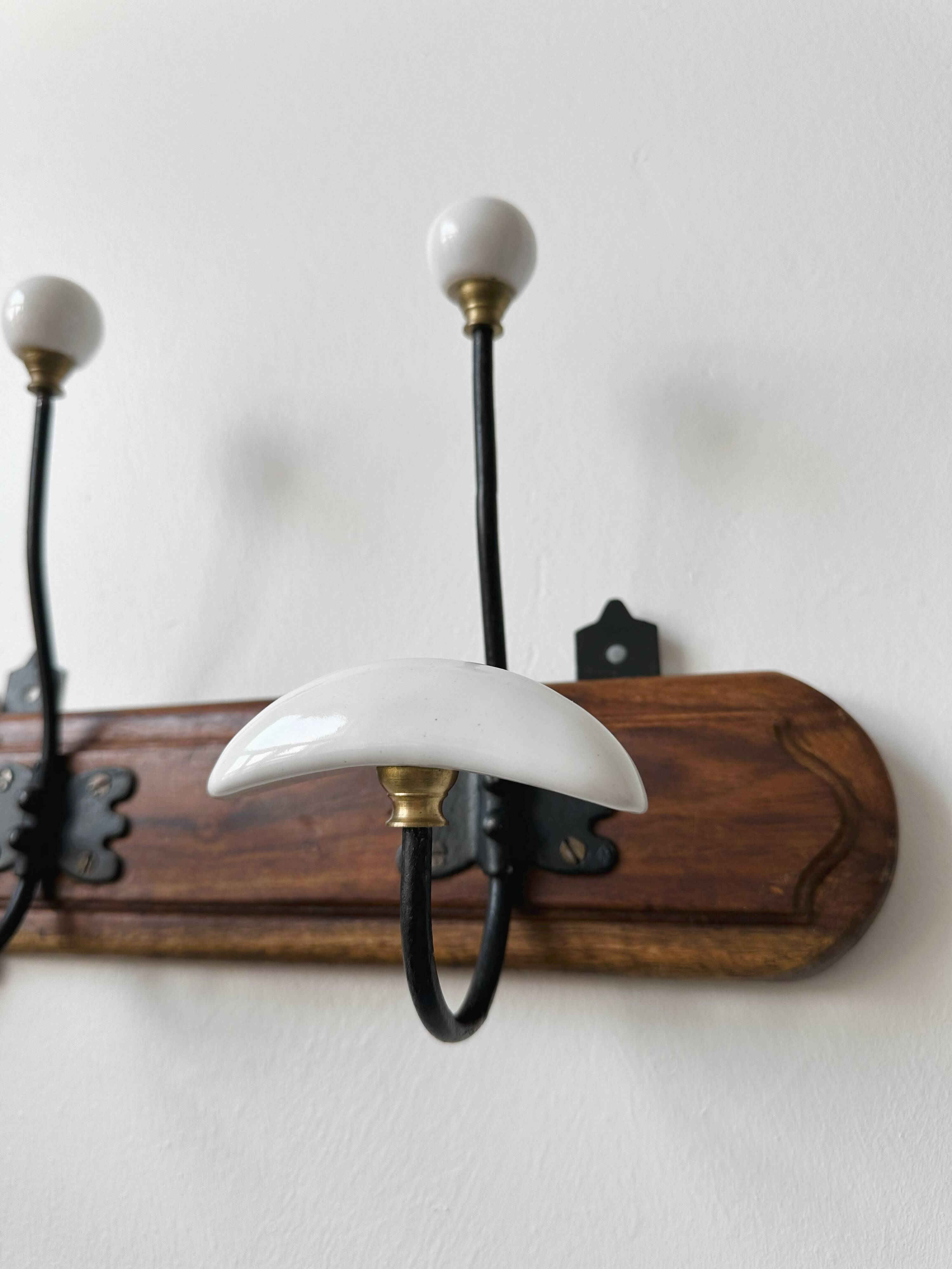 Set of two wooden and porcelain coat hooks