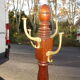 Coat rack known as "Parrot" in mahogany and bronze, circa 1950