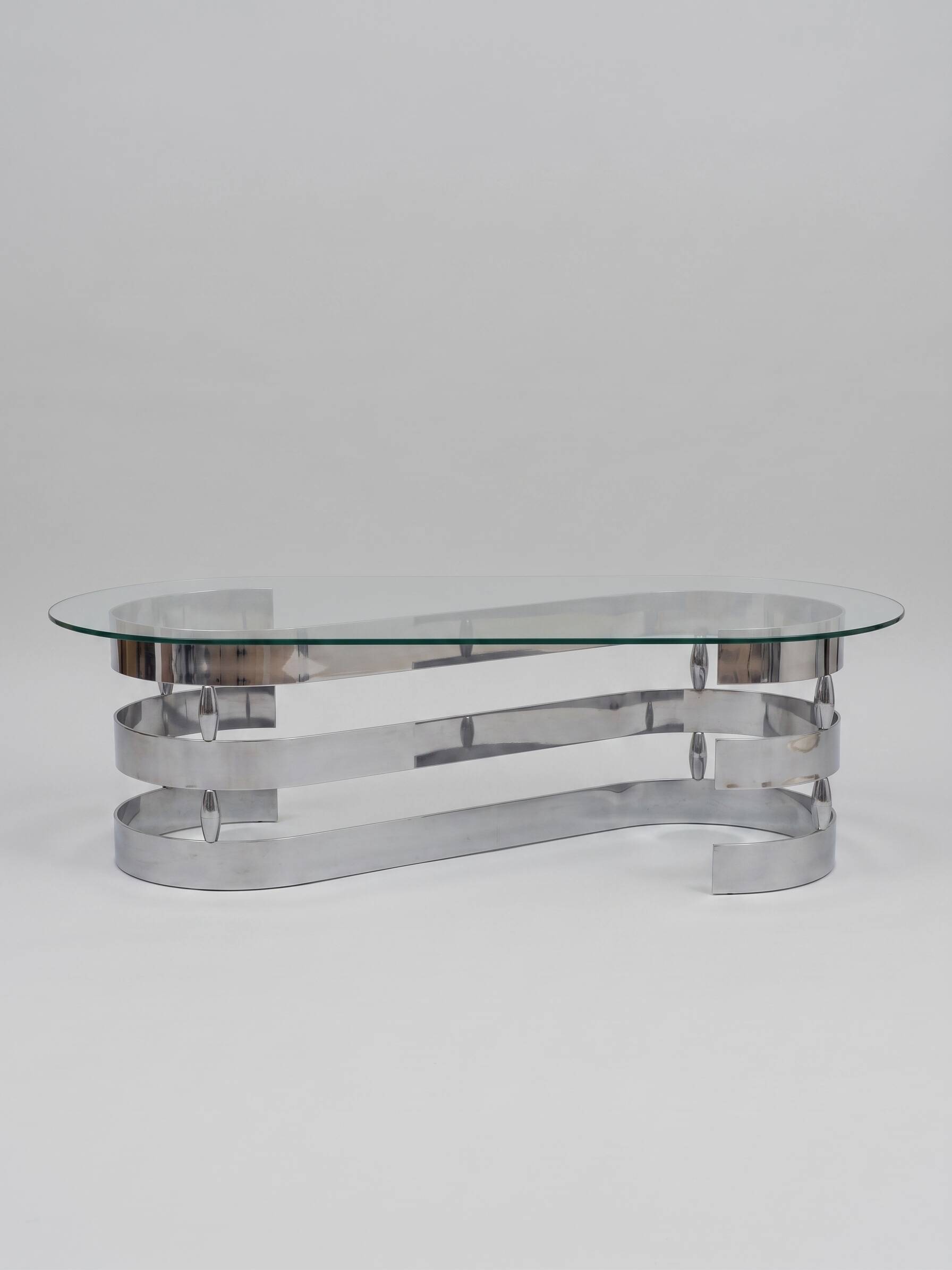 70s oval design coffee table in glass with chrome S legs.