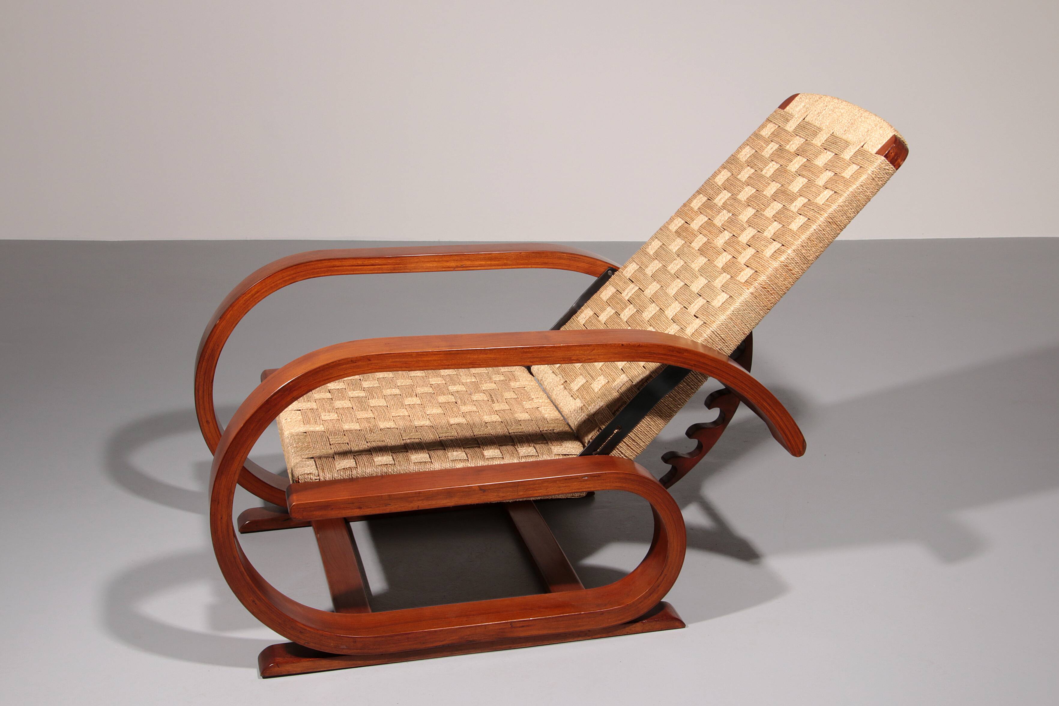 An exceptionally rare mahogany recliner crafted in Italy during the 1950s"