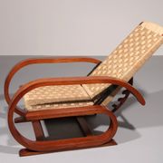 An exceptionally rare mahogany recliner crafted in Italy during the 1950s"