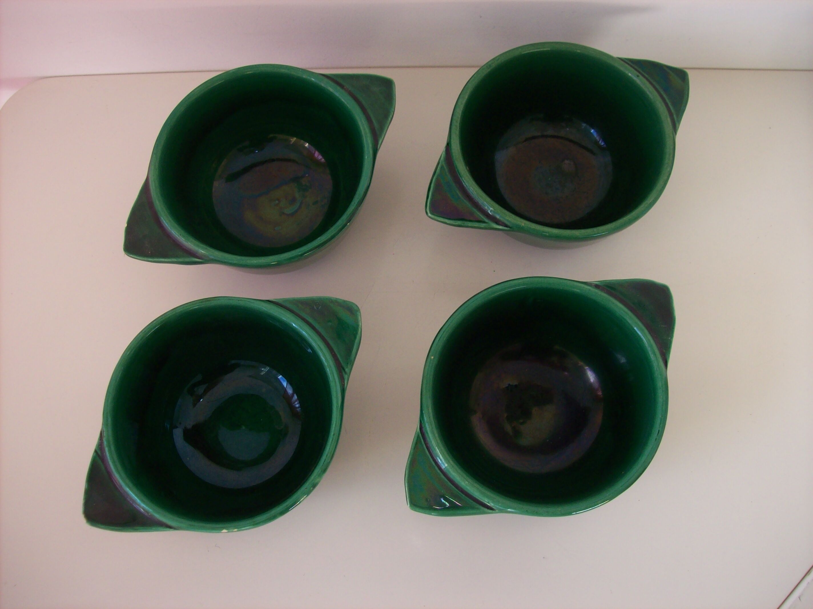 Suite of four former St. Clement bowls