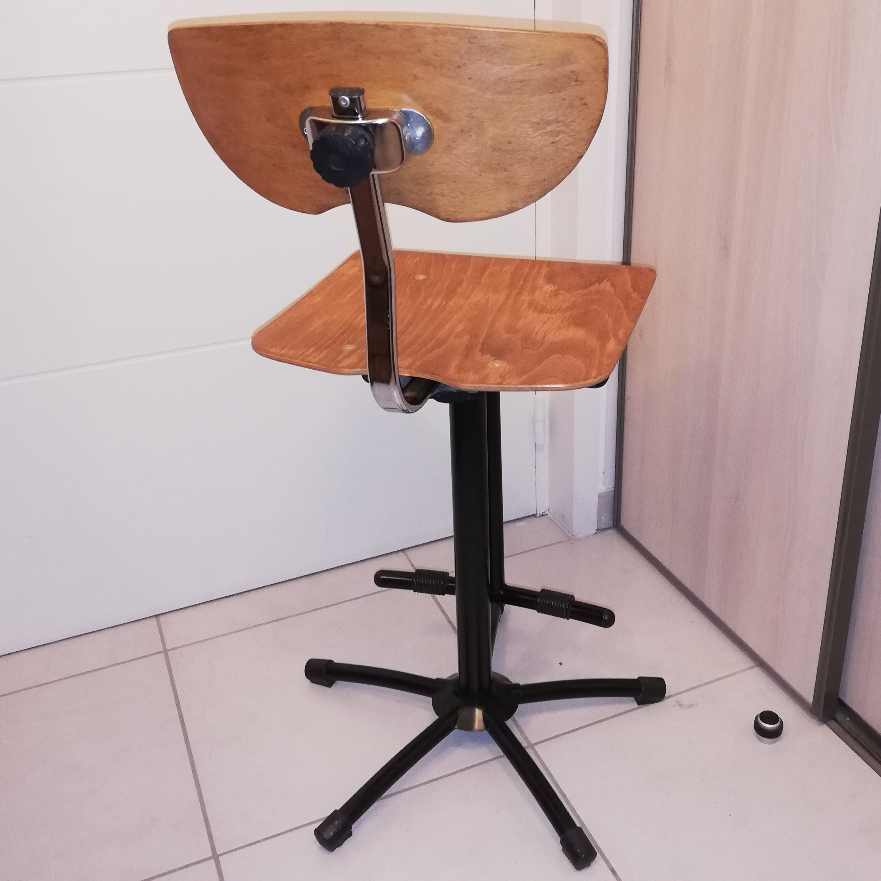 Industrial chair with height adjustment and foot rests