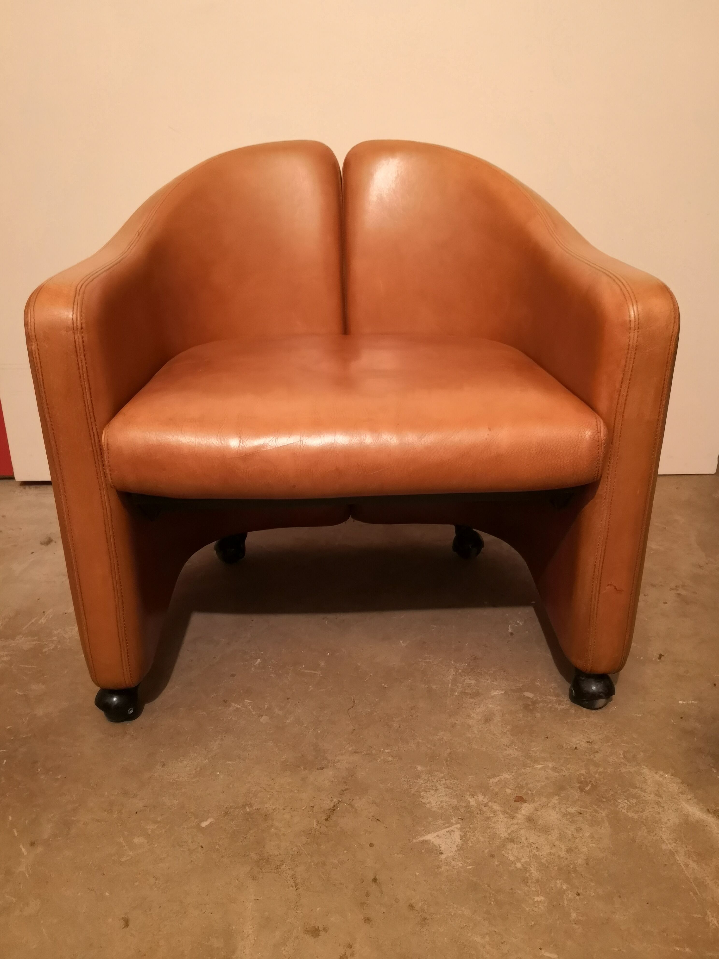 Pair of leather armchairs by Eugenio Gerli