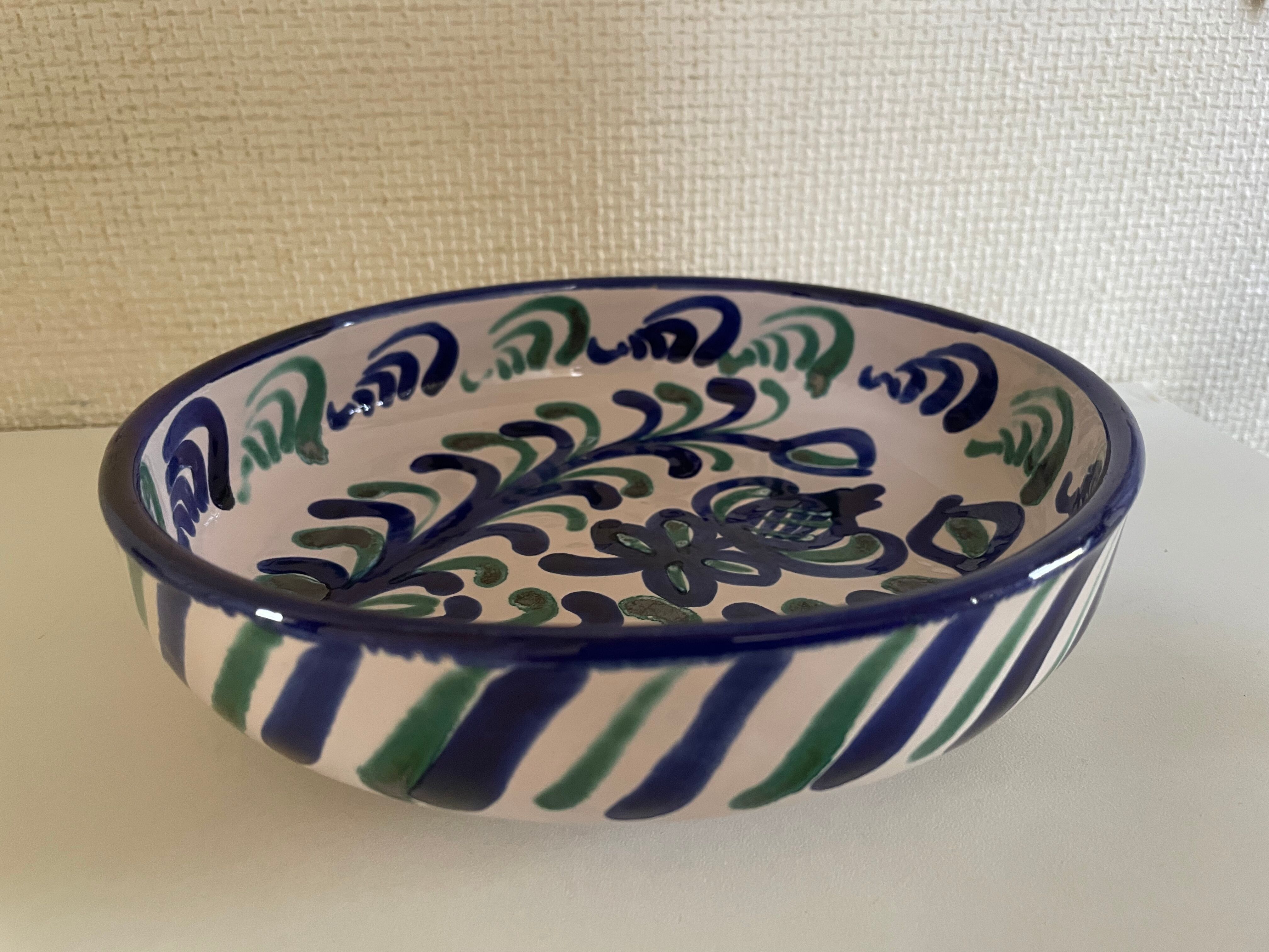 Hollow plate in ceramic from Granada.