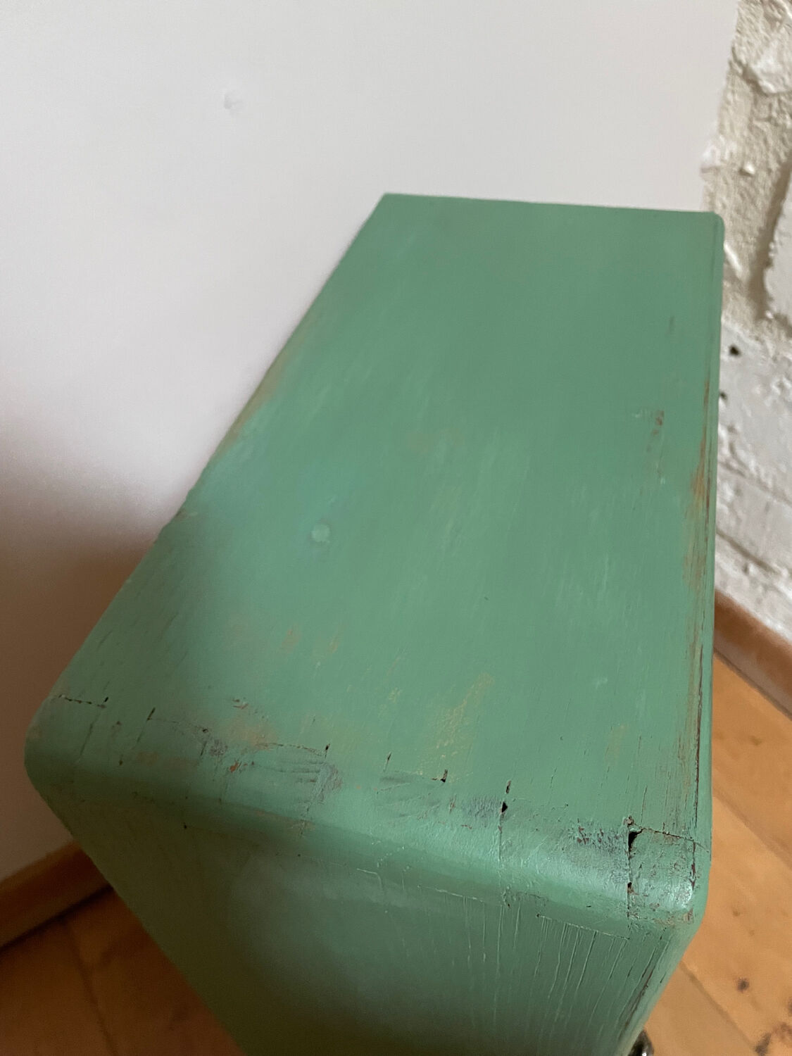 Small wooden cabinet patinated arsenic green