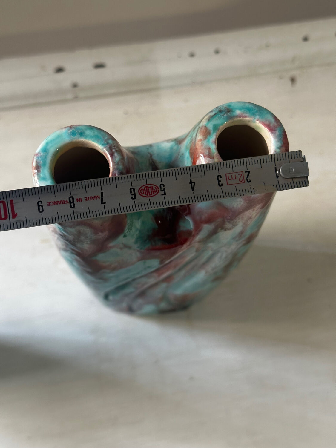 Vintage pair of turquoise and red ceramic candlesticks