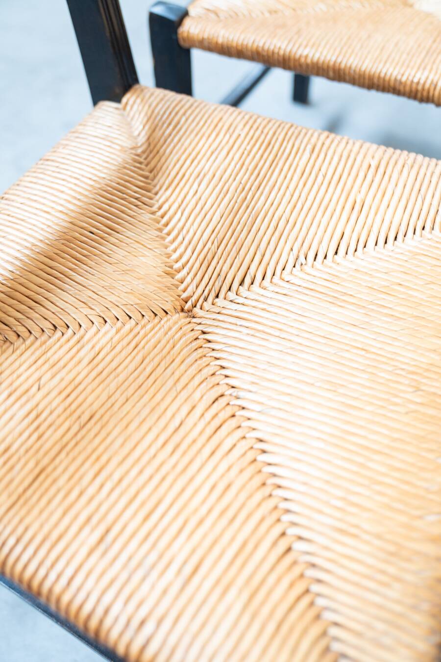 2 low bedroom chairs in hand-woven rice straw, 1950s/1960s