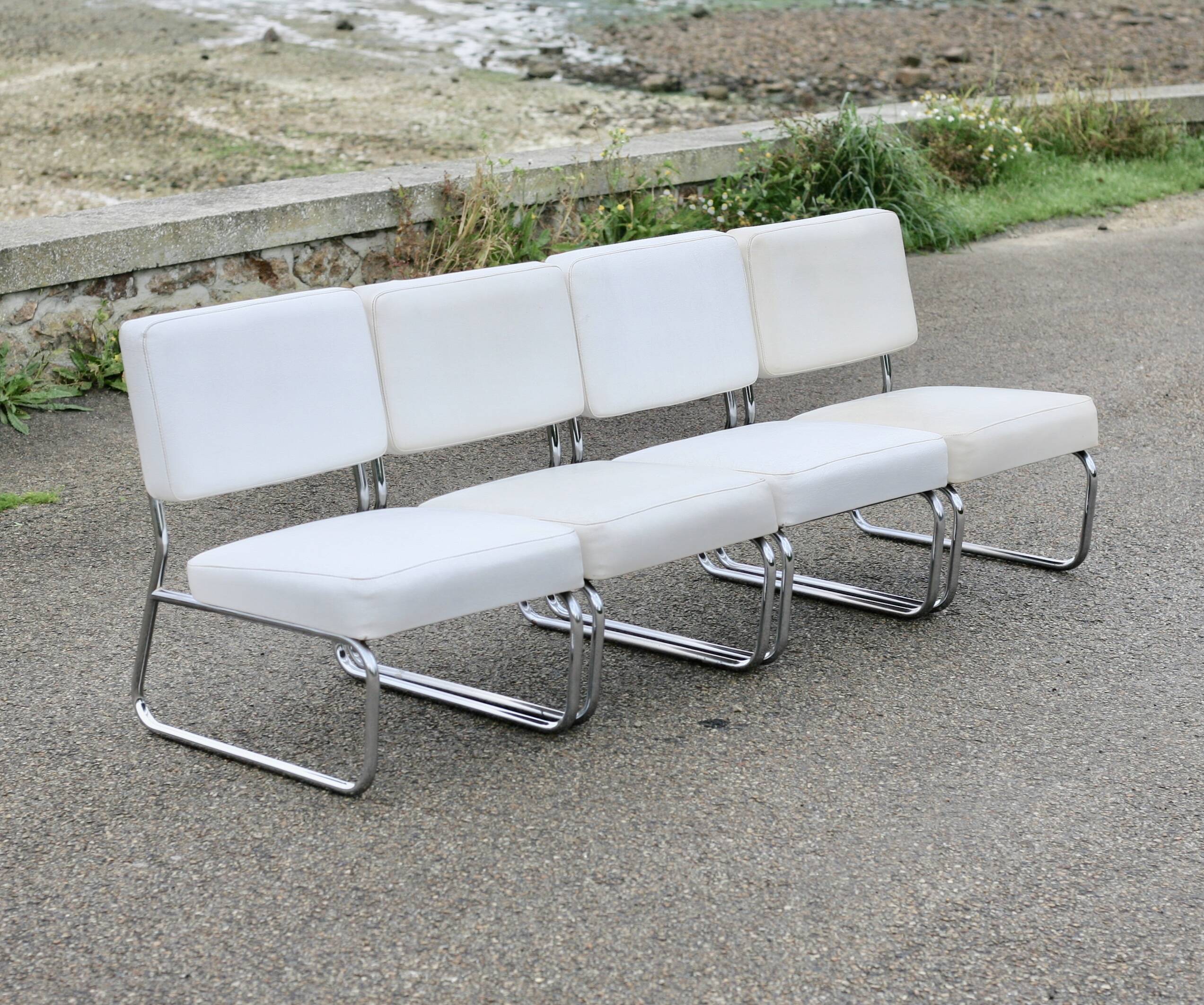 4 armchairs forming a modular sofa. Steel, imitation leather, 70s
