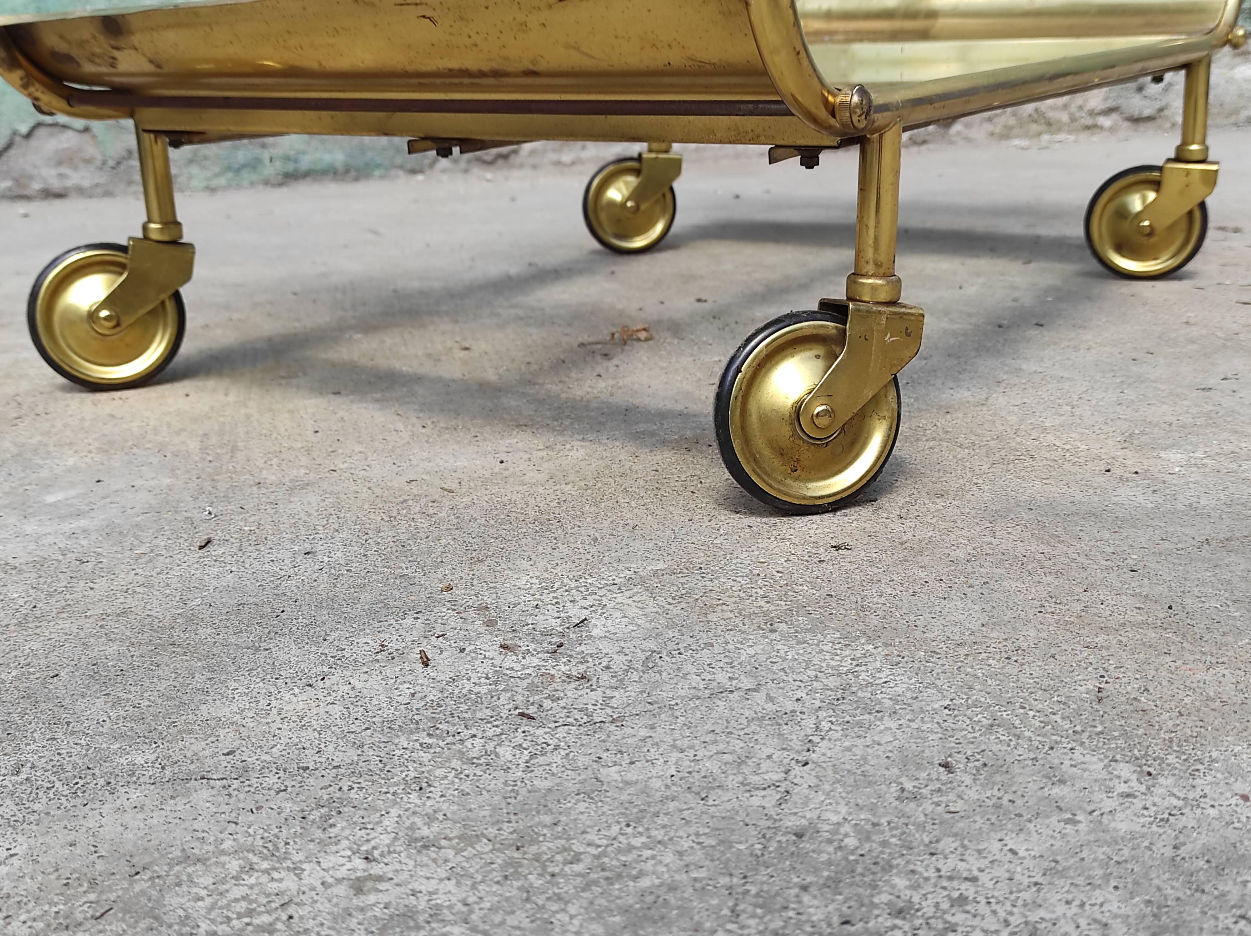 Old rolling coffee table serving vintage brass bar 50s mid-century design