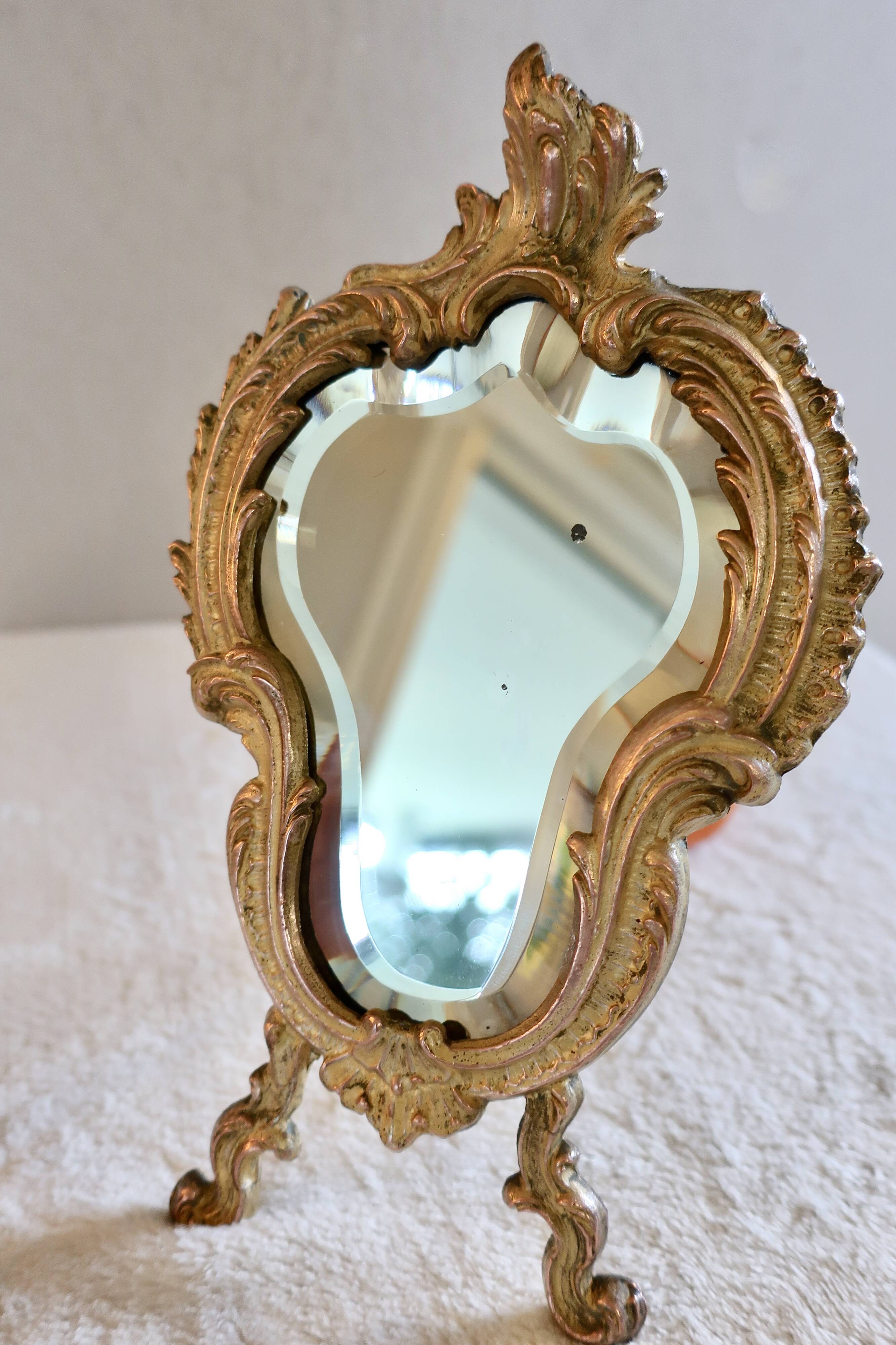 Small vintage 19th century mirror or hand mirror, bronze, beveled glass, baroque, rococo style.