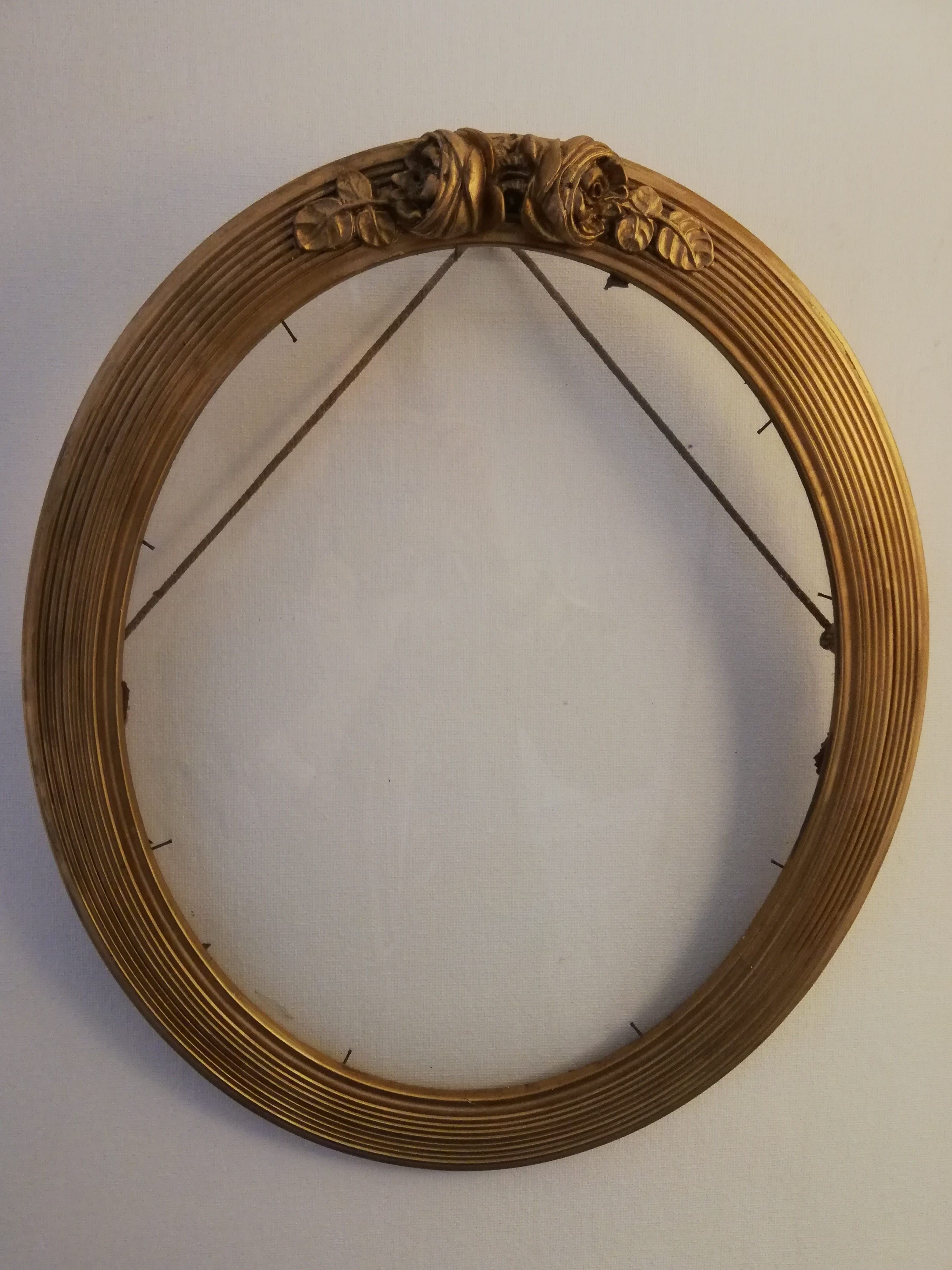 Oval gold frame art deco