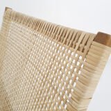 Rattan and leather low-back lounge chair by P.J. Muntendam for Gebr. Jonkers, The Netherlands 1950's