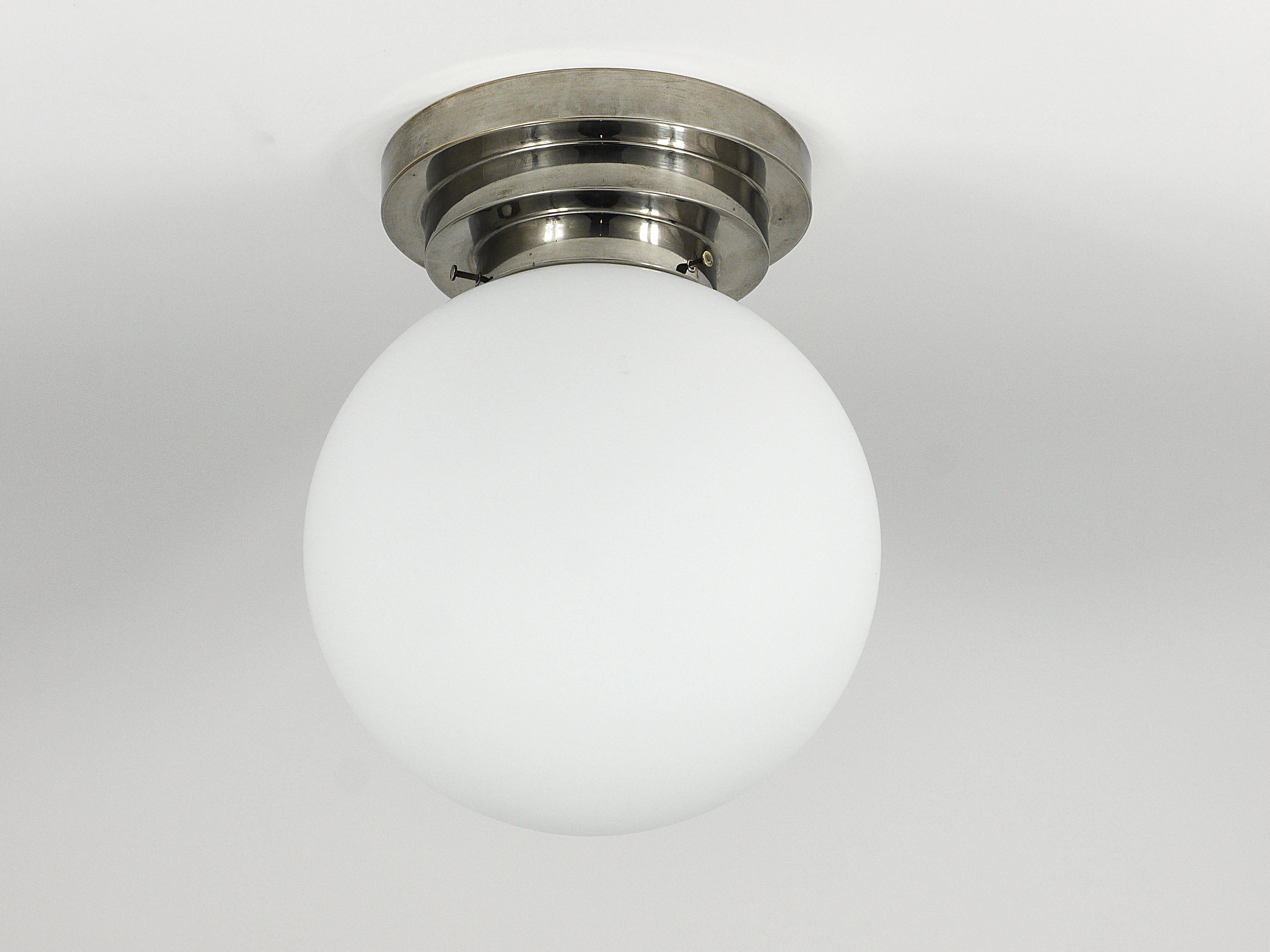 Large opaline glass globe ceiling lamp in Art Deco style.