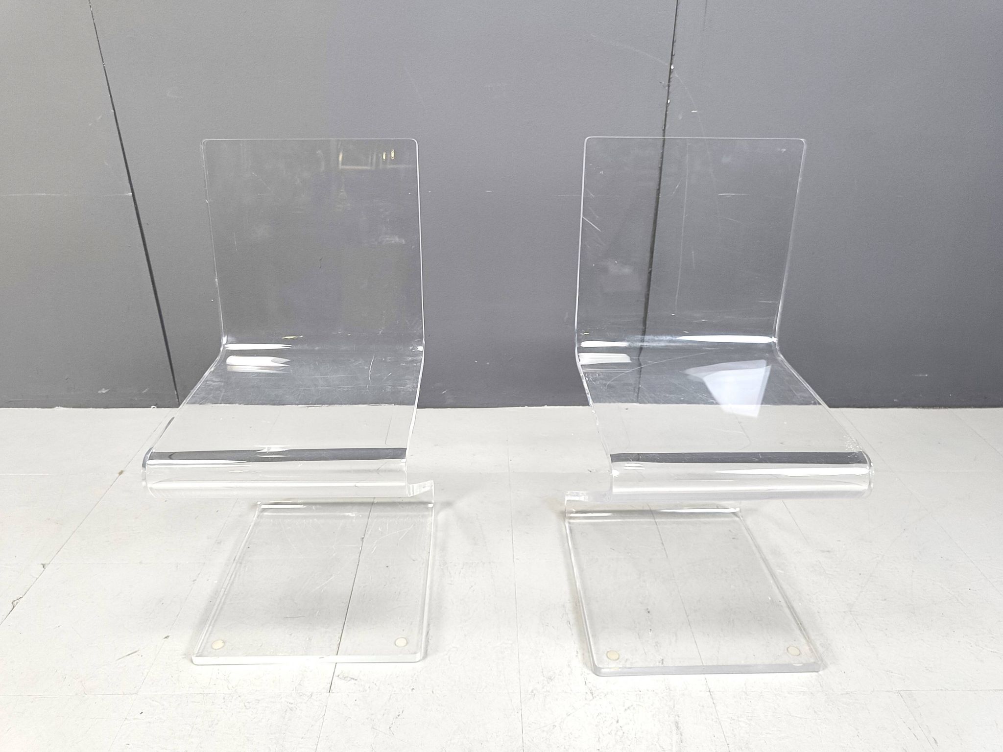 Pair of lucite zigzag dining chairs, 1980s