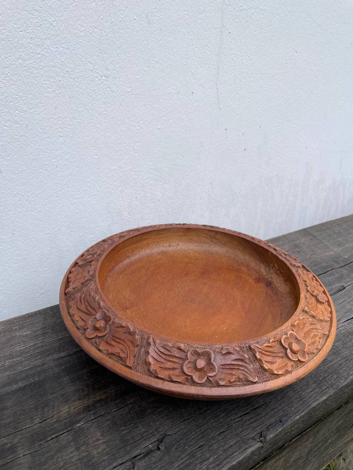 Carved wooden pocket emptier