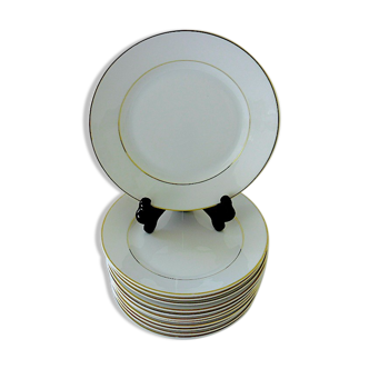 Suite of twelve table plates in white and gold porcelain.