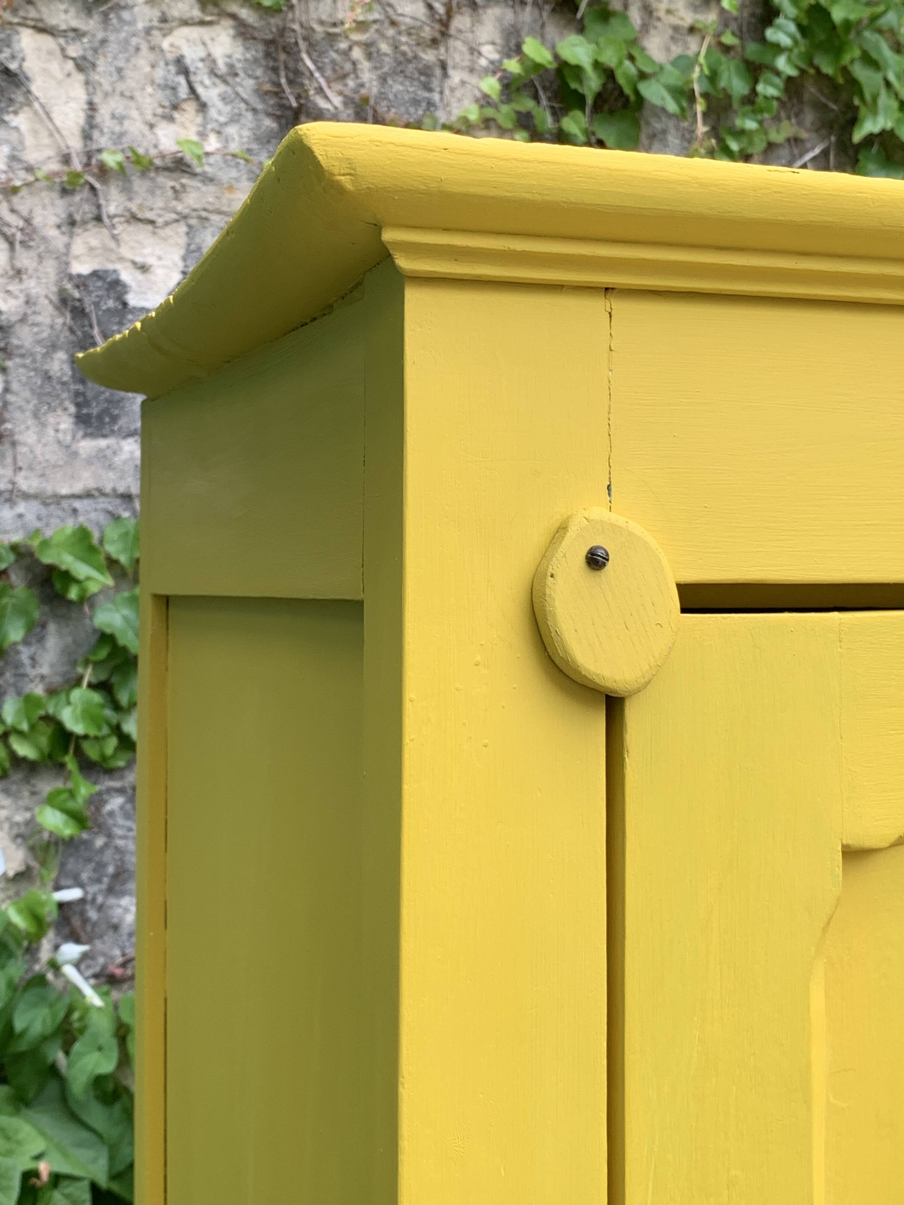 Antique powder yellow Parisian bonnetière wardrobe.