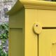Antique powder yellow Parisian bonnetière wardrobe.