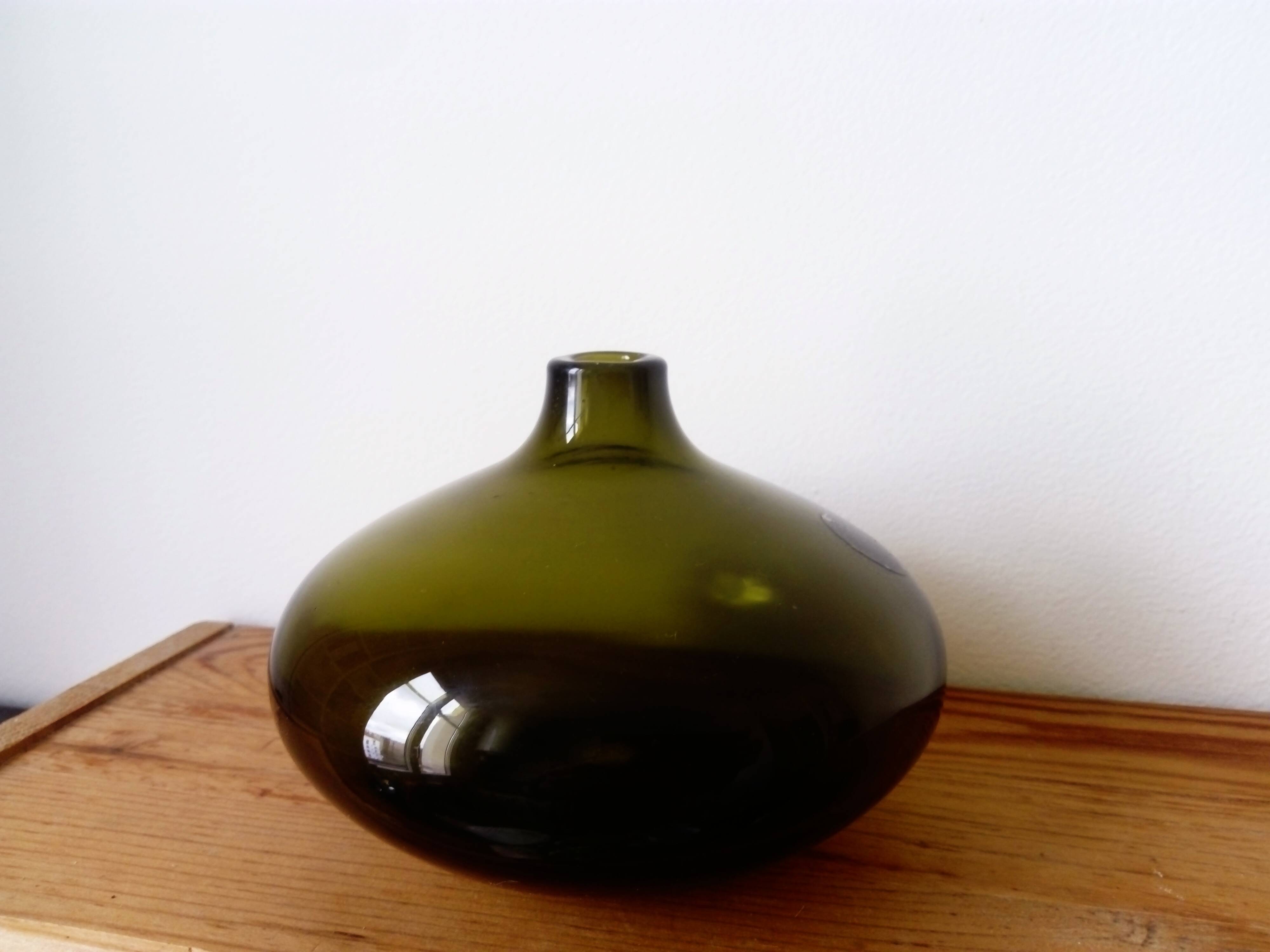 Small dark green handmade glass ball vase
