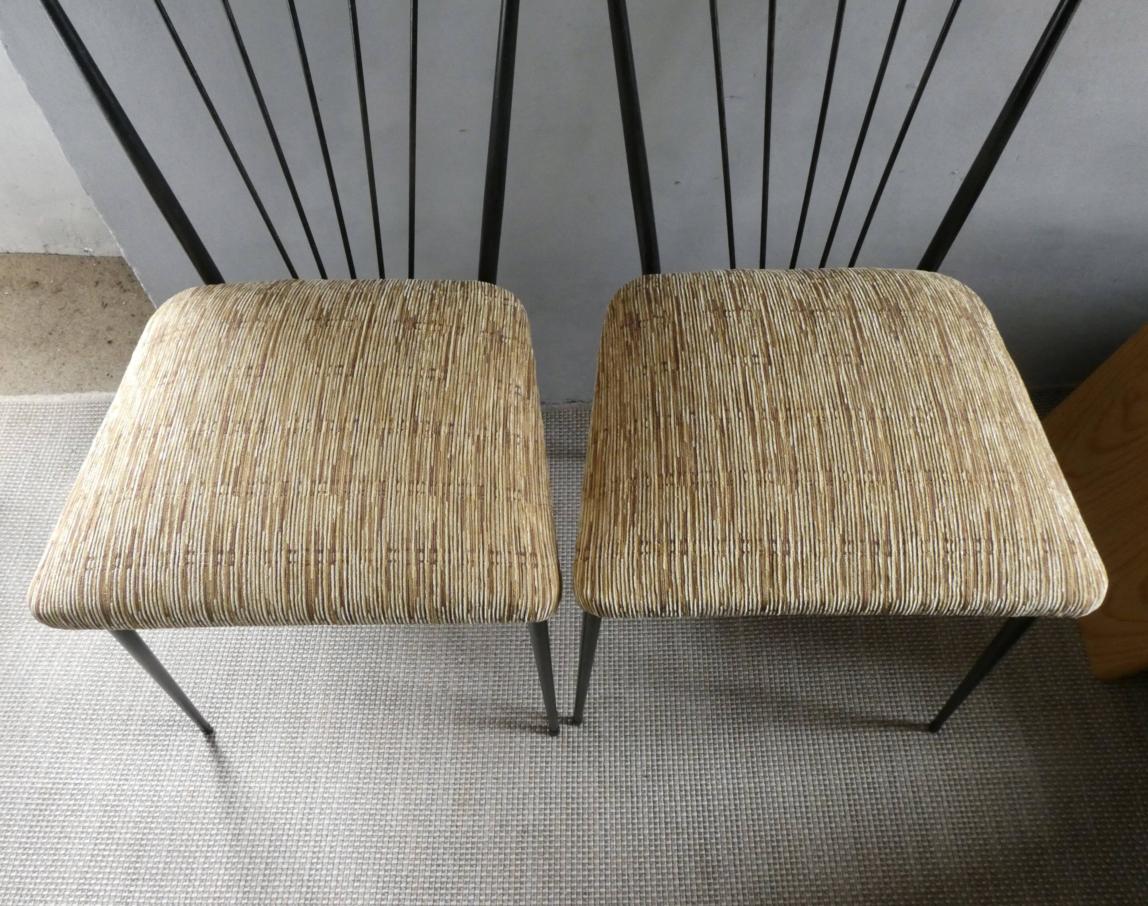 Pair of Colette Gueden chairs, black metal and fabric.