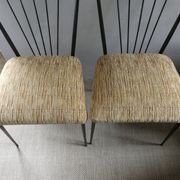 Pair of Colette Gueden chairs, black metal and fabric.