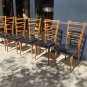 6 chaises bois et skaï noir années 60
