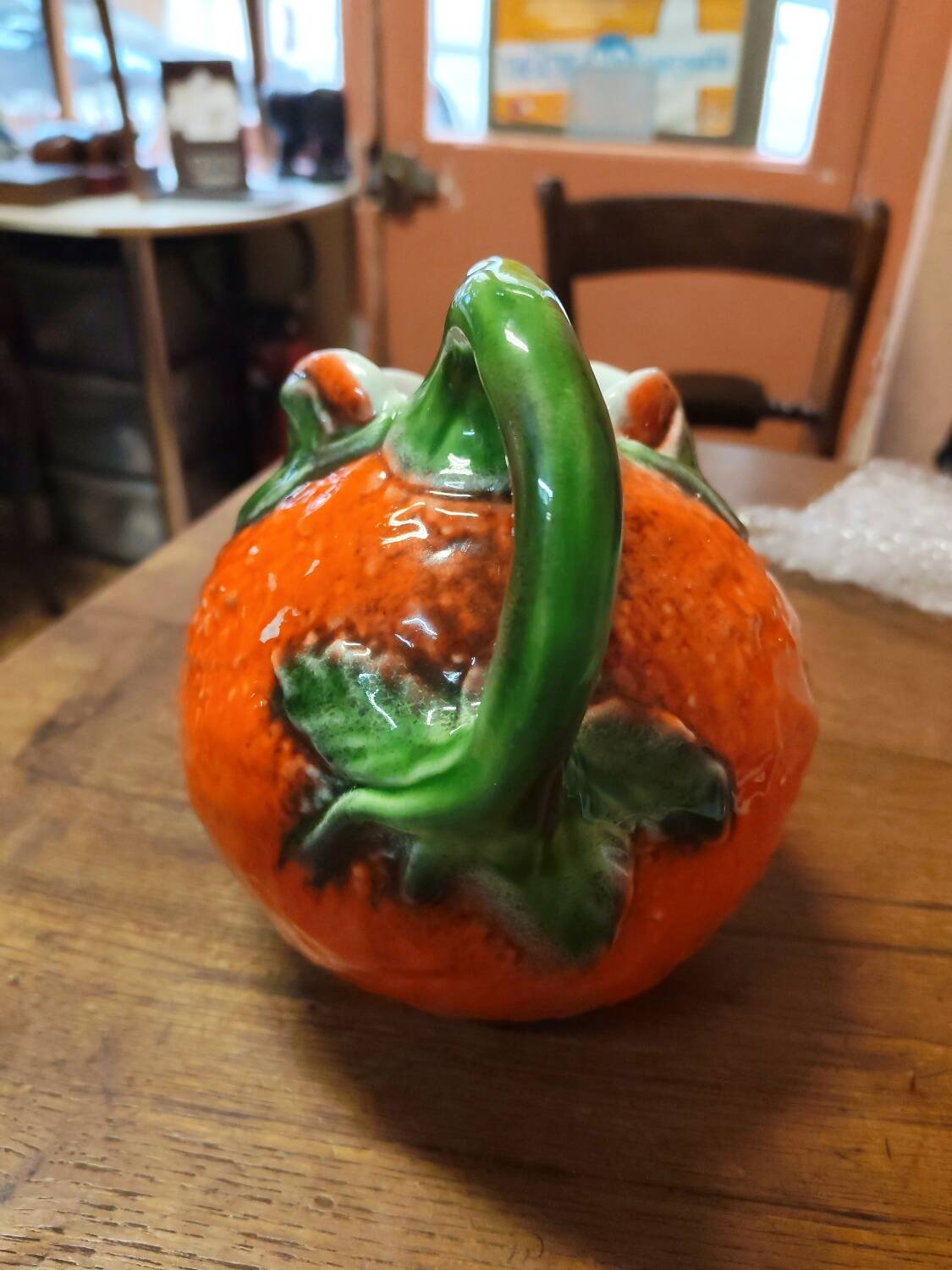 Orange slipware pitcher