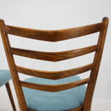 Ensemble de quatre chaises à manger années 1960.