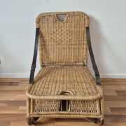 Vintage foldable beach chair, picnic in rattan and leather.