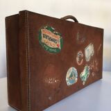 Suitcase of leather with labels of palaces