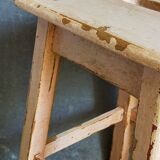 Antique workshop stool in patinated solid wood