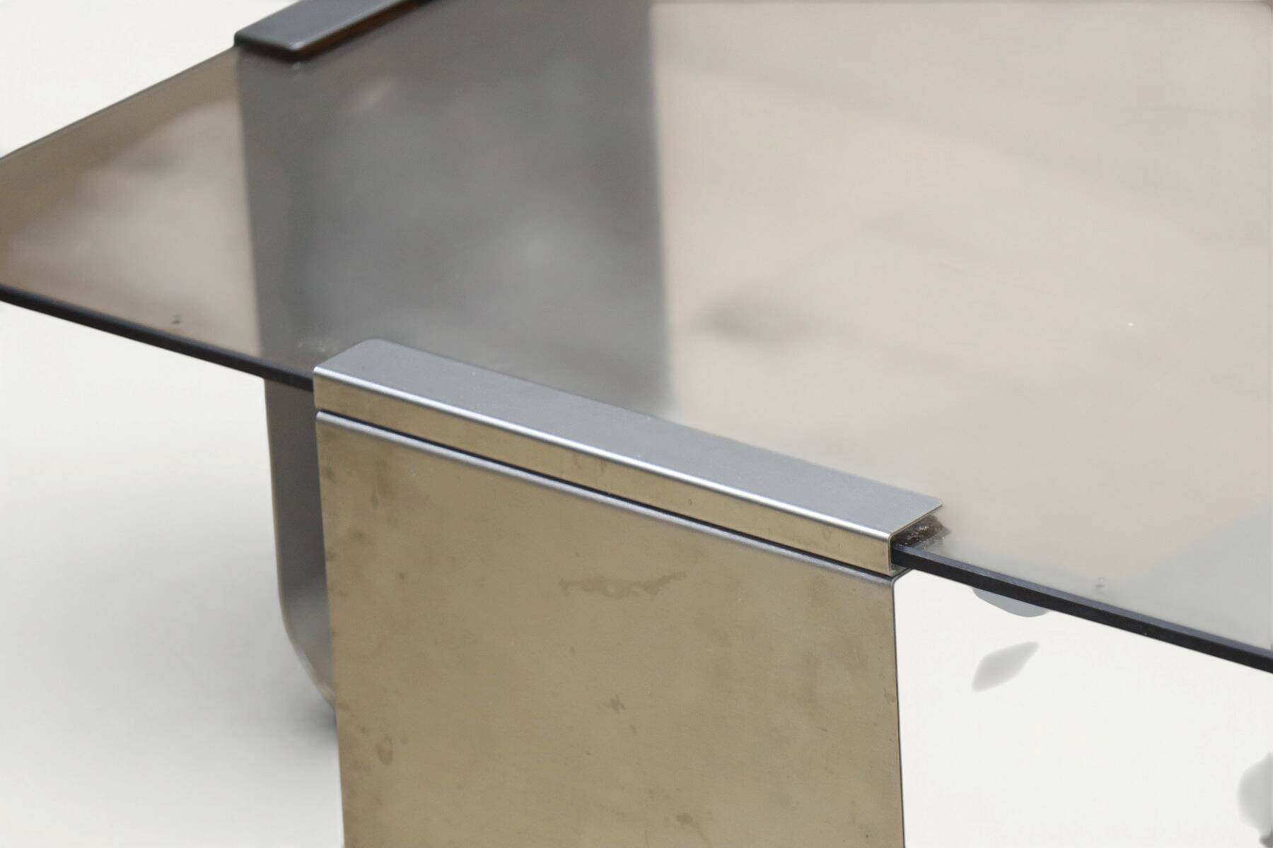 Brushed steel and smoked glass coffee table, by François Monnet – 1970s