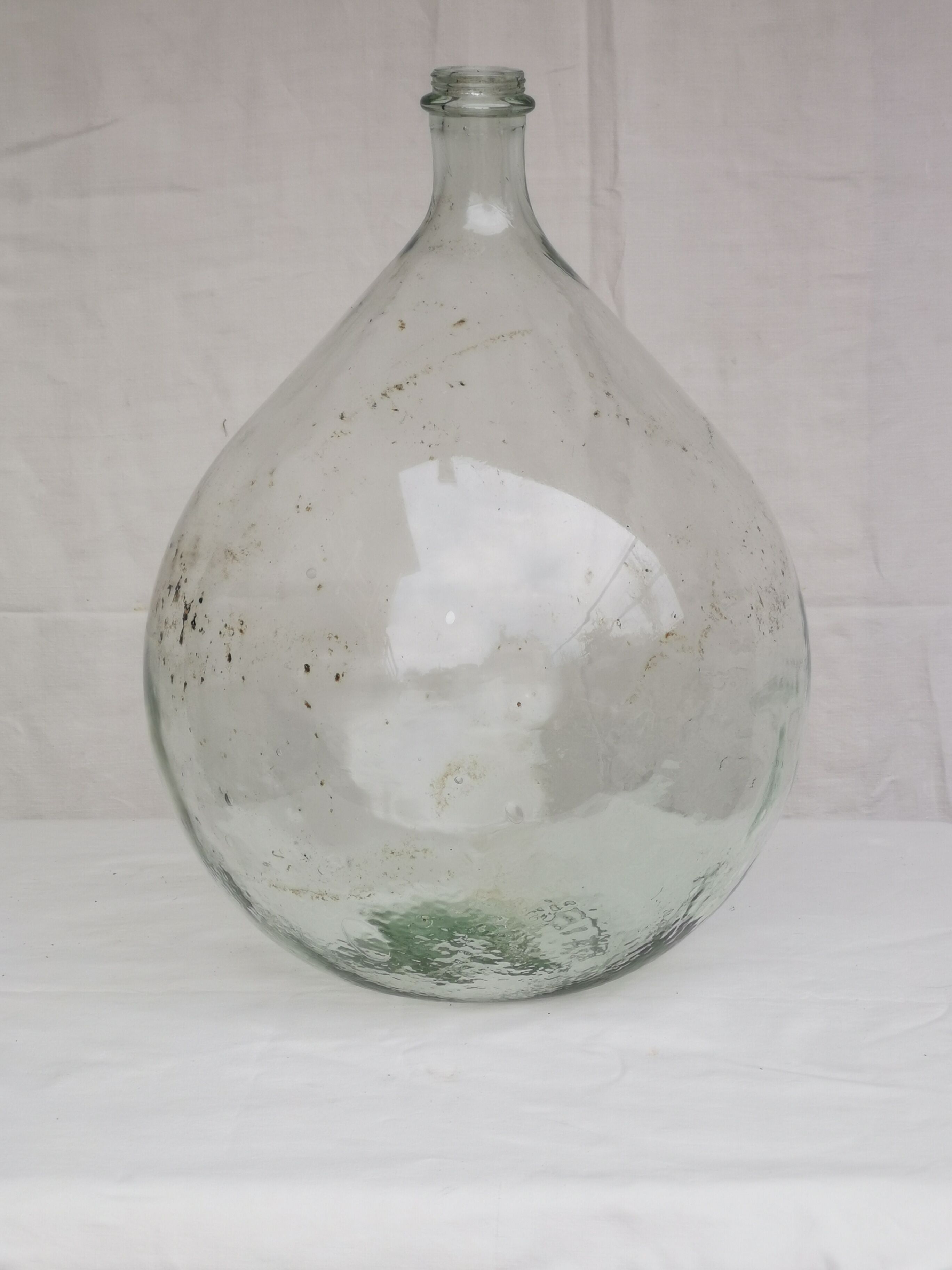 Large old lady Jeanne in transparent glass