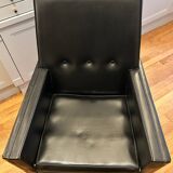 Modernist armchair in wood and black synthetic leather, circa 1960