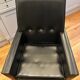 Modernist armchair in wood and black synthetic leather, circa 1960