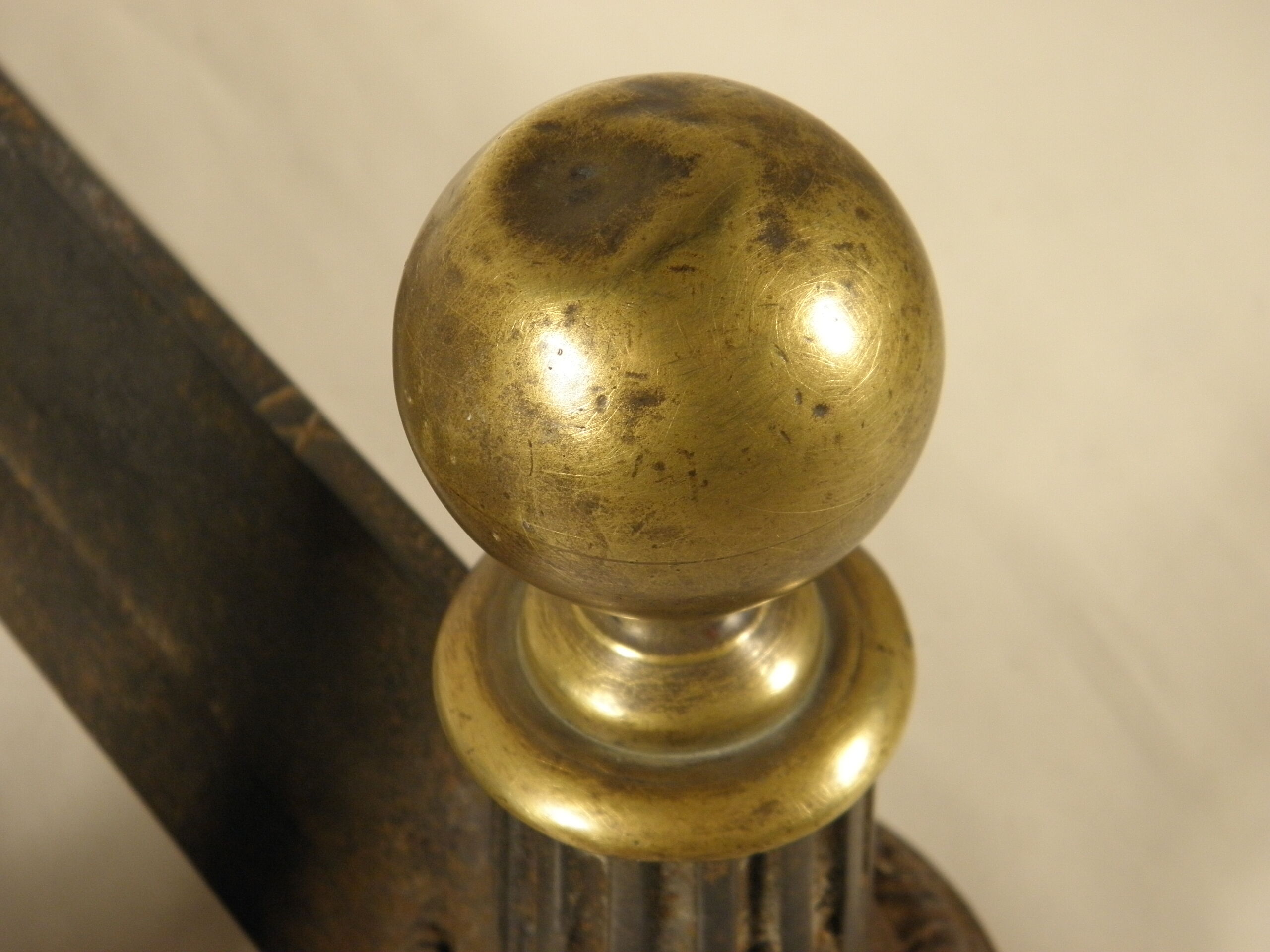 Pair of cast iron and brass chenets